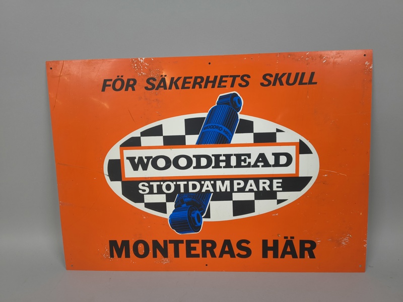  Skylt, Woodhead stötdämpare, automobilia, plast
