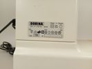 Symaskin, Dorina